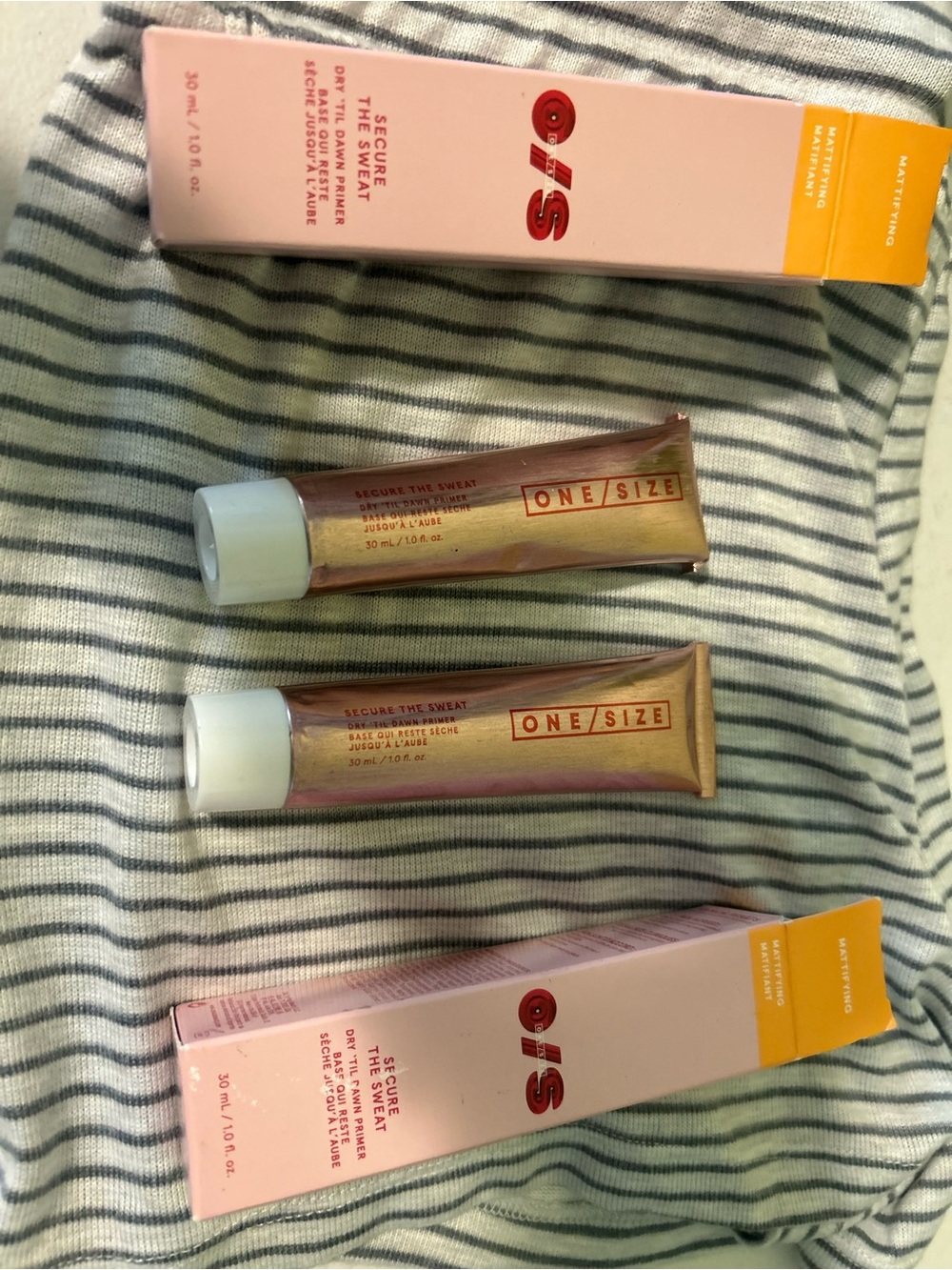 Two full sized ONE/SIZE Secure The Sweat Primer